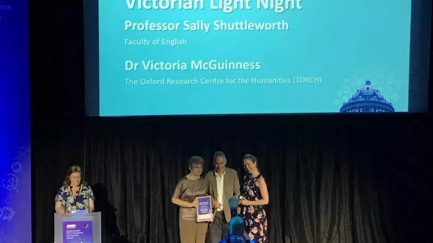 Photograph of Sally Shuttleworth accepting the award