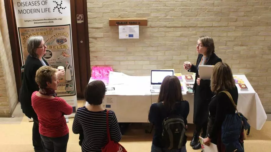 Teachers discussing GCSE resources with Dr Catherine Charlwood. Photo credit: Nathan Stazicker