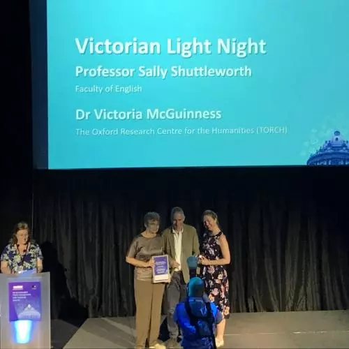 Photograph of Sally Shuttleworth accepting the award